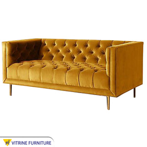 A yellow sofa with capotonite grains from the inside