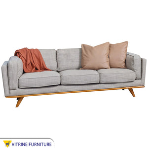 Sofa with armrests and short back in gray color