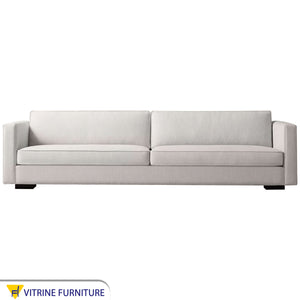 White sofa with thin armrests