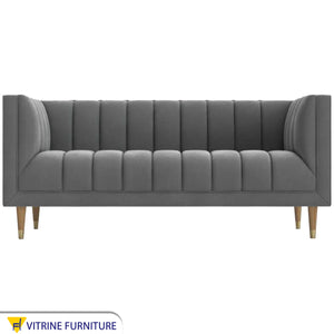 Gray sofa with recessed lines on the back and base