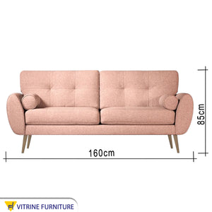 Pink sofa high on elegant wooden legs