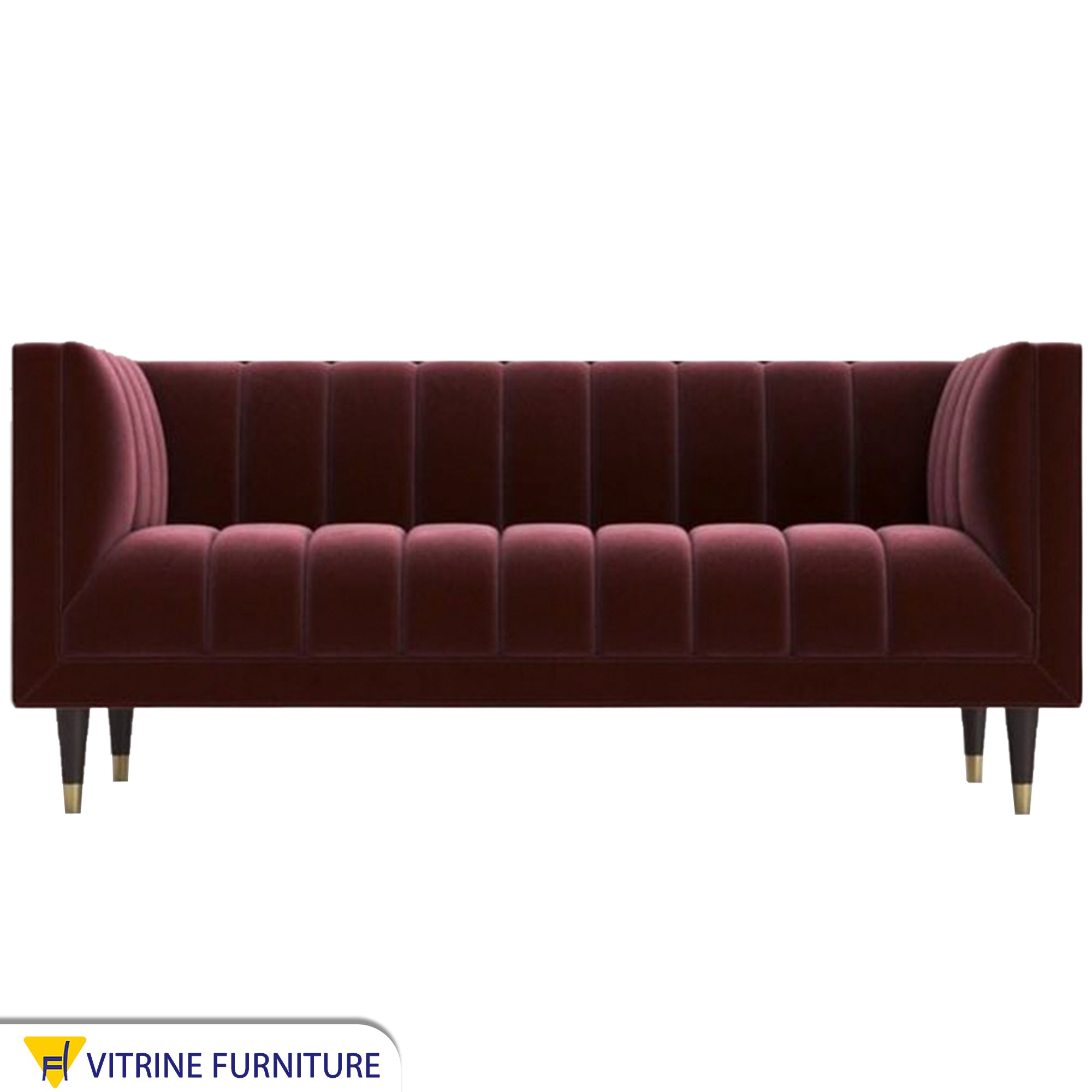 A sofa in a burgundy color with recessed lines on the back and the base