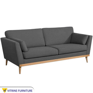 Dark gray high sofa on wooden legs