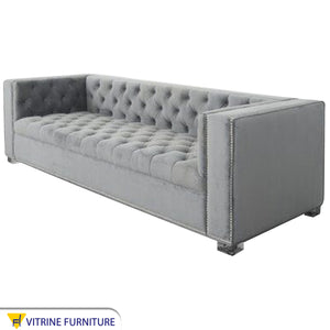 Light gray sofa with high armrests