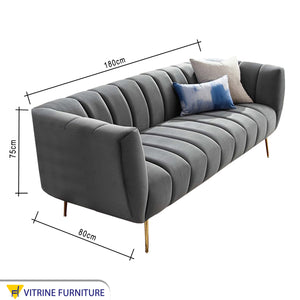 Modern light gray sofa with high legs