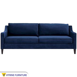 Blue sofa with curved armrests