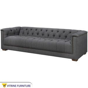 Dark gray sofa with high armrests