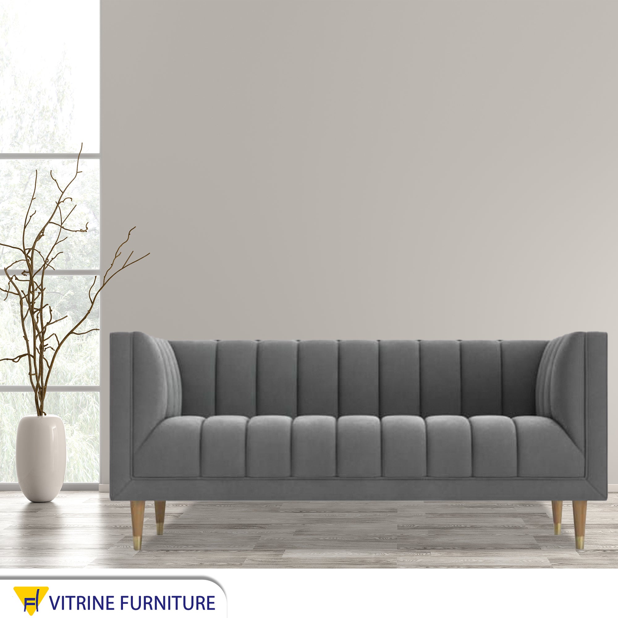 Gray sofa with recessed lines on the back and base