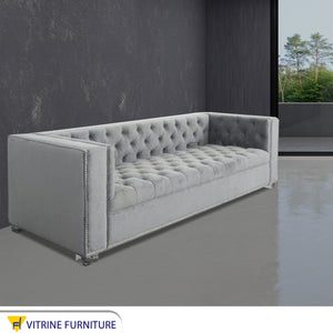 Light gray sofa with high armrests