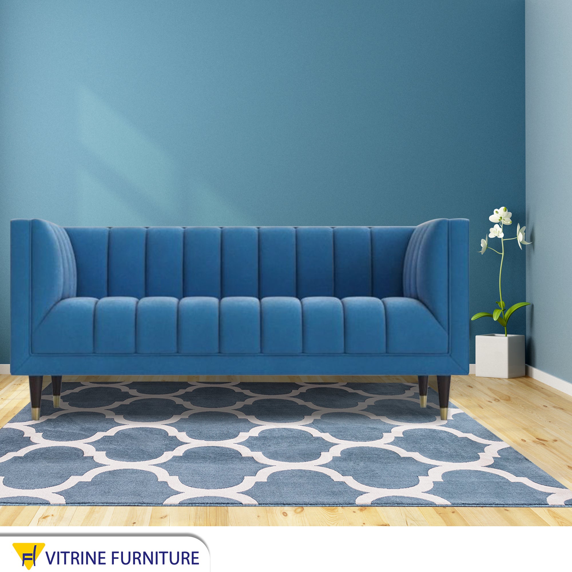 Baby blue sofa with recessed lines on the back and base
