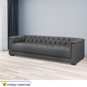 Dark gray sofa with high armrests