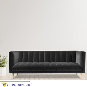 Black sofa with capotonian stripes