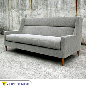 Modern gray sofa on wooden legs