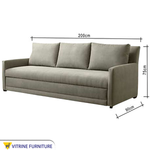 A sofa with three back cushions