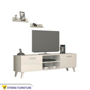 White TV screen unit with slanted legs