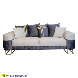 White and indigo living room cushions with a gold ribbon
