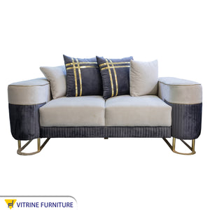 White and indigo living room cushions with a gold ribbon