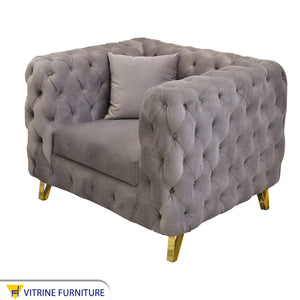Fully capotain grey living room with golden legs