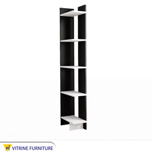 A decorative piece for corner shelves in black and white