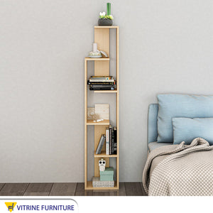 A decorative piece for a small beige high cabinet with interchangeable shelves