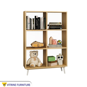 A decorative piece for a beige wardrobe with square shelves