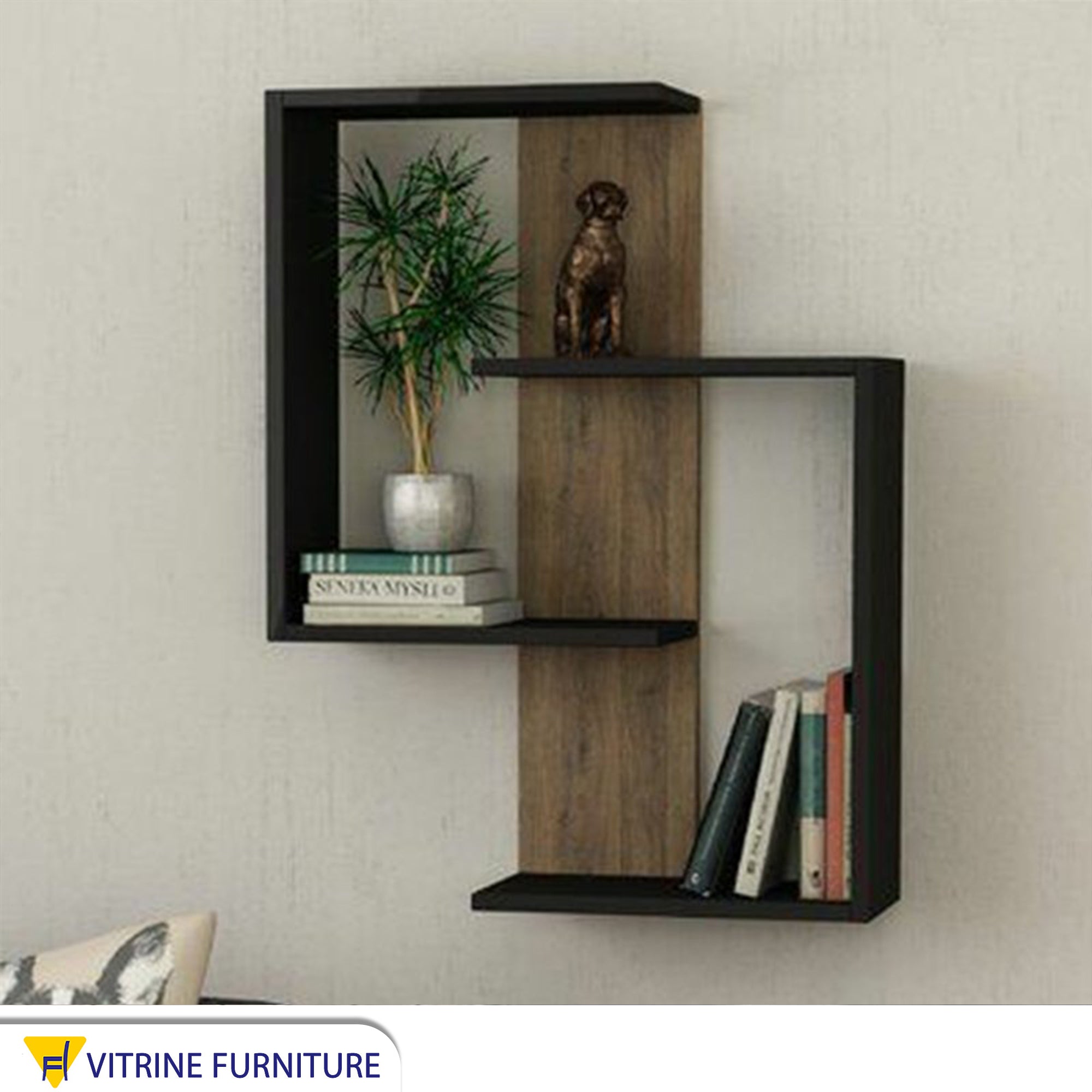 A decorative piece for a black and beige wall shelf
