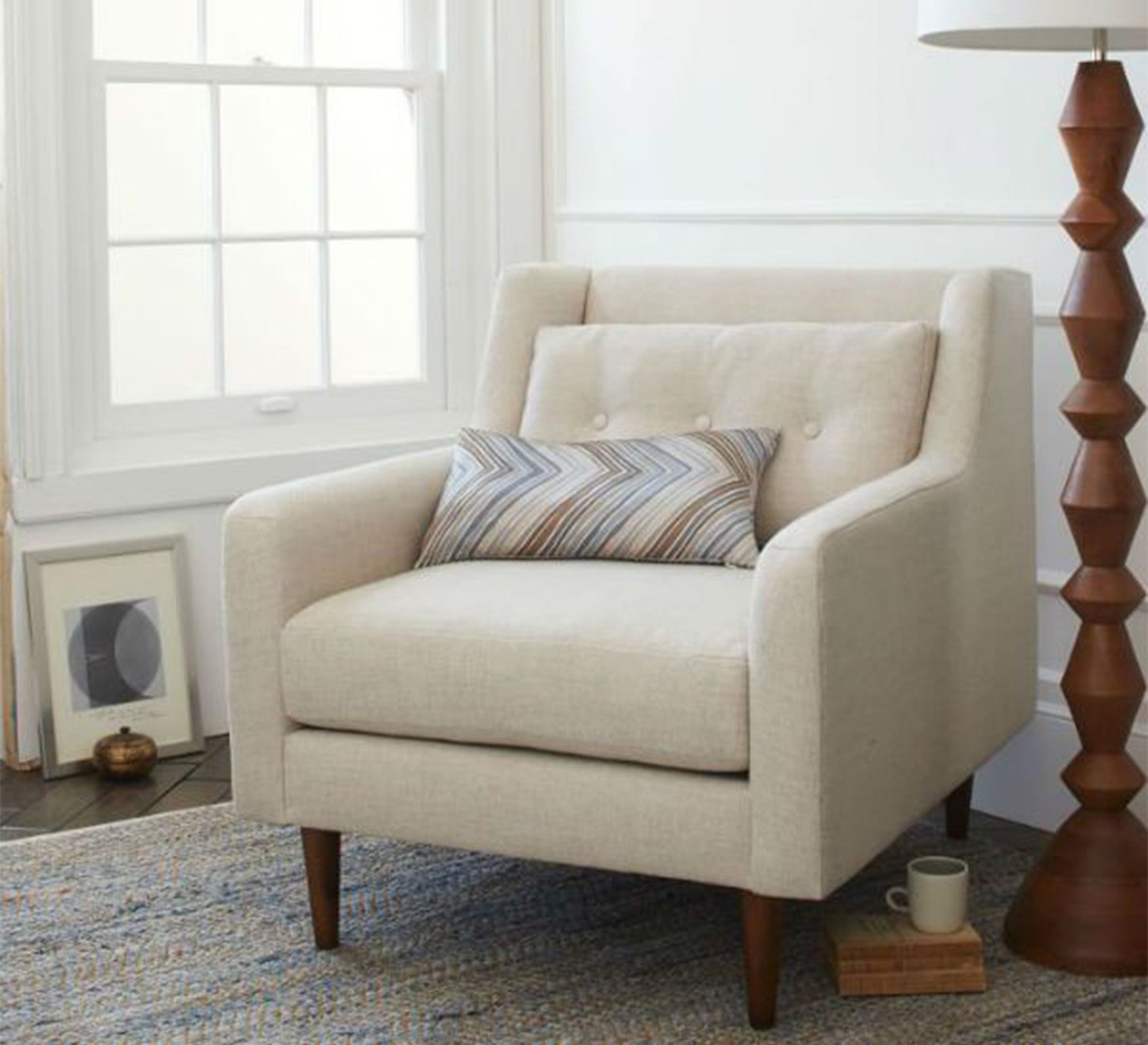 Beige footstool with thin armrests