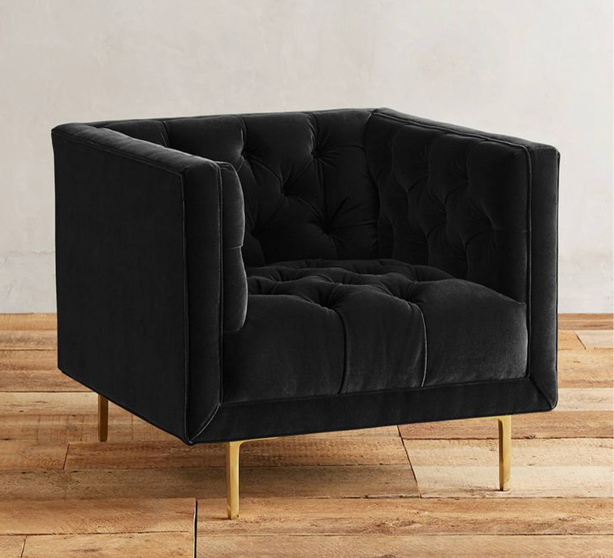 A black footstool in a square shape