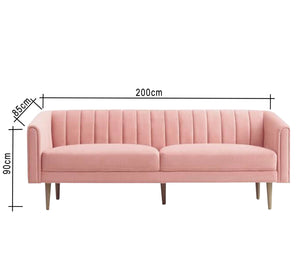 A pink parallelepiped capotone sofa