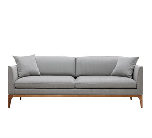 Gray sofa with high wooden legs