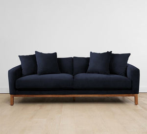 Navy sofa with short wooden legs