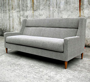 Modern gray sofa on wooden legs