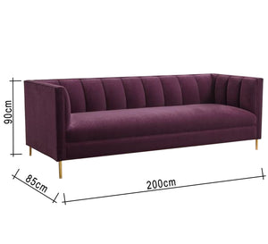 A burgundy sofa with successive recessed lines on the backrest