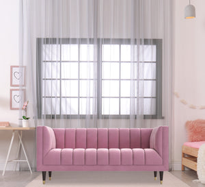 Rose color sofa with recessed lines on the back and base