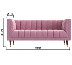 Rose color sofa with recessed lines on the back and base