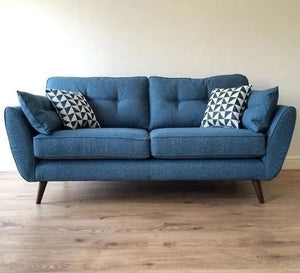 Dark blue sofa with curved armrests