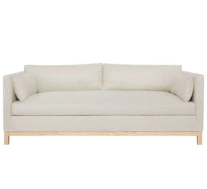 Off white sofa with armrests cushions