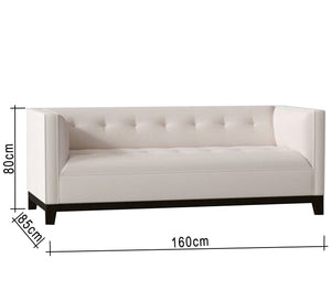 White sofa and black wooden legs