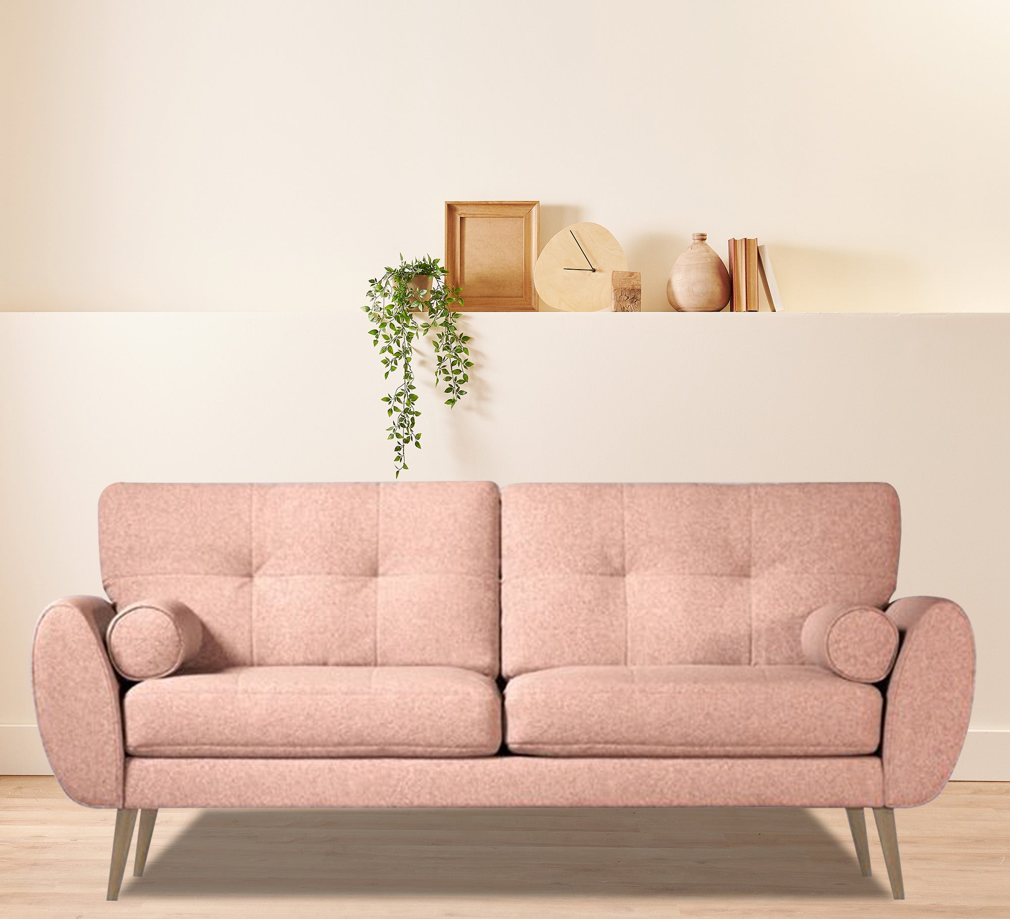 Pink sofa high on elegant wooden legs