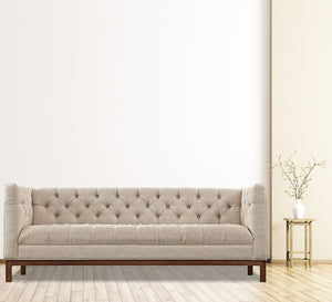 Beige sofa with capotonite grains on the back and the handle