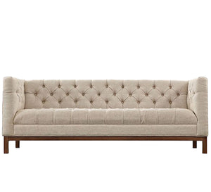 Beige sofa with capotonite grains on the back and the handle