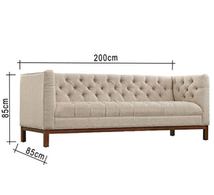 Beige sofa with capotonite grains on the back and the handle