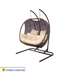 Brown swing chair for two people