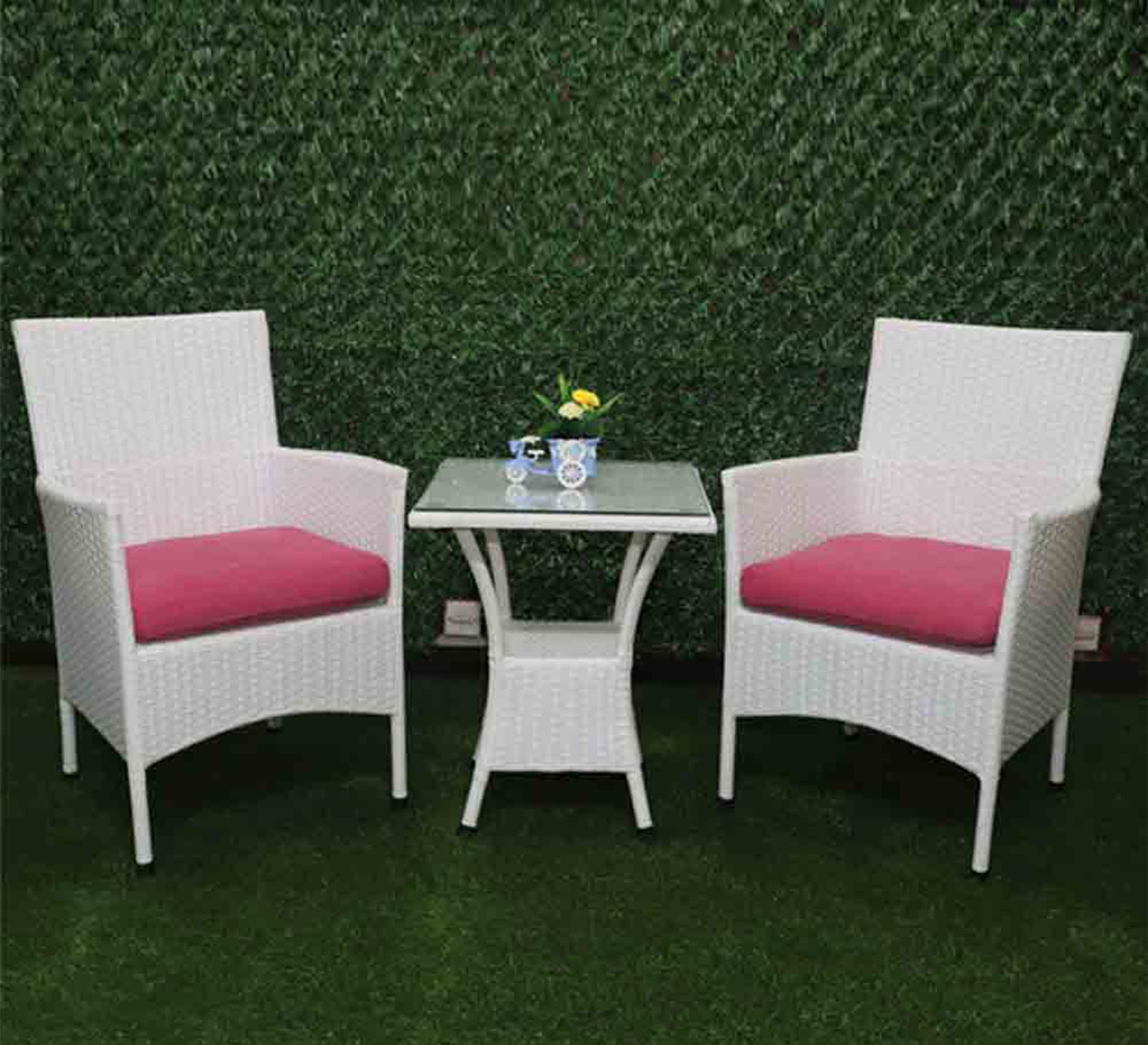 An outdoor seating set with a square table