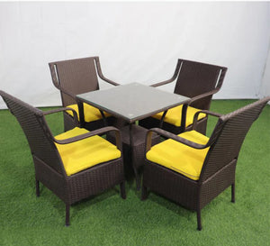 An outdoor set of 4 chairs and a table