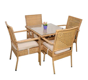 An outdoor set of 4 beige chairs and a table