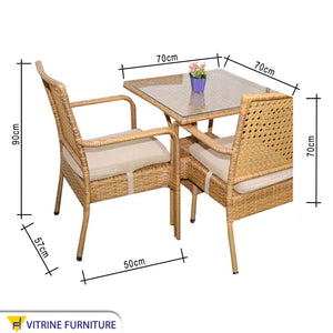 An outdoor set of 4 beige chairs and a table