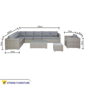 An outdoor set with a corner, a chair and two tables