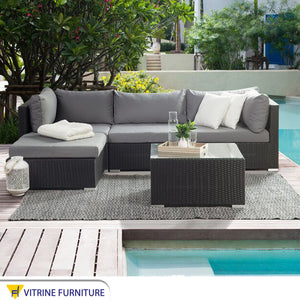 An outdoor set with a L-shape sofa set