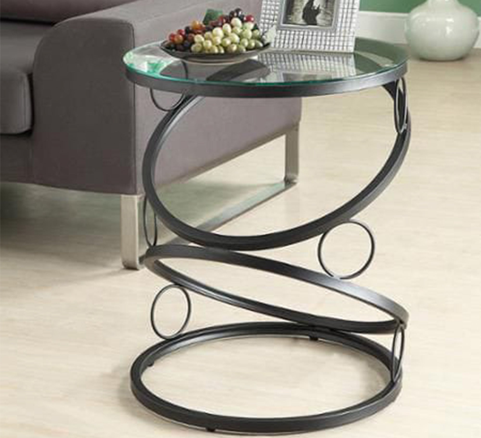 A circular table in black with a unique design